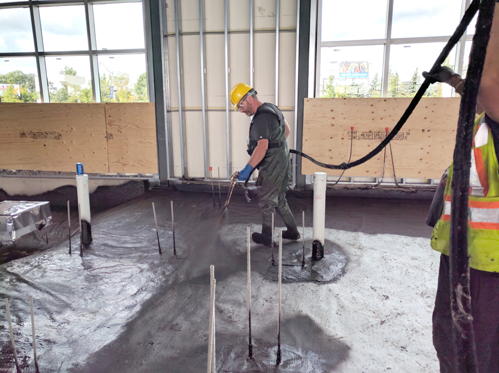 Epro employee installing waterproofing system.