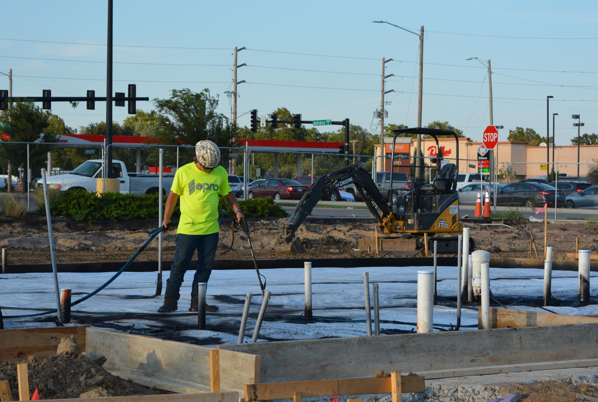 EPRO employee working on waterproofing system.