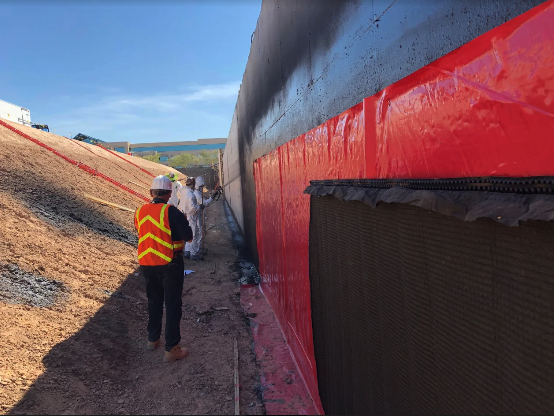 Construction with waterproofing being done.