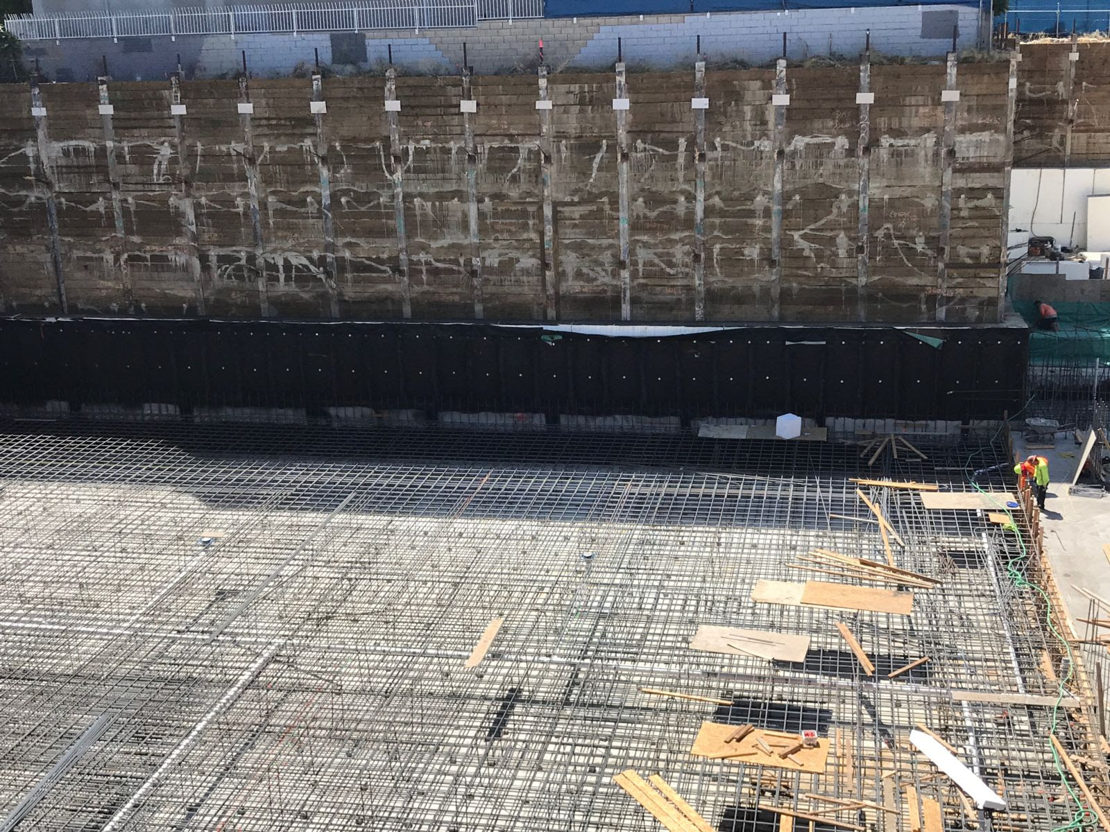 Blindside waterproofing system at construction site.